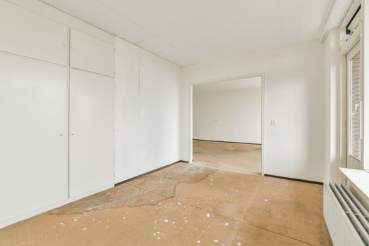 Modern room with wooden floor and white walls