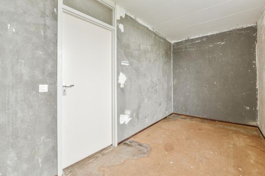 Modern room with wooden floor and white walls