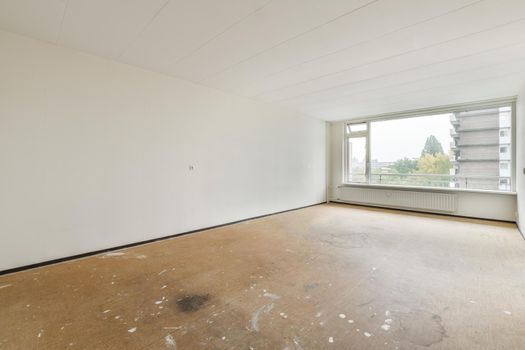 Modern room with wooden floor and white walls