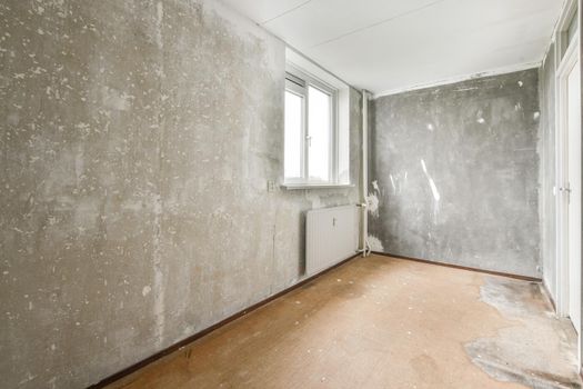Modern room with wooden floor and white walls