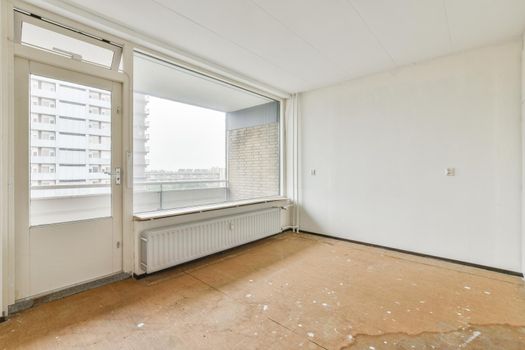 Modern room with wooden floor and white walls