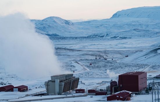 Geothermic plant in Iceland over the snow, long shot