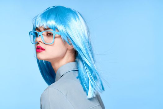 beautiful woman in blue wig glasses fashion glamor. High quality photo