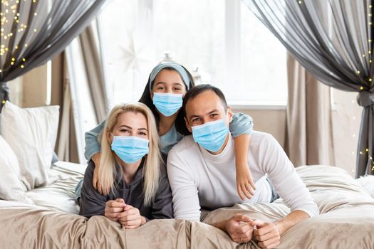 People with gifts wearing facemasks during coronavirus and flu outbreak on Christmas. Virus and illness protection, home quarantine. COVID-2019