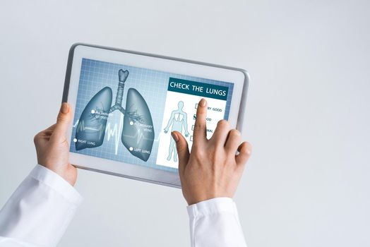 Tablet pc device with medicine interface screen in hands of doctor
