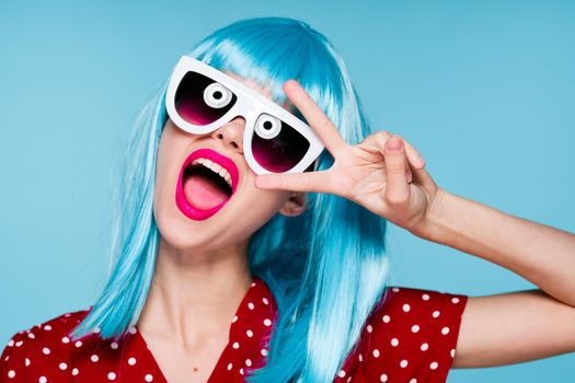 cheerful woman in blue wig sunglasses Glamor makeup. High quality photo