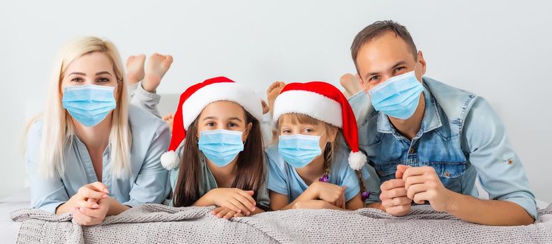People with gifts wearing facemasks during coronavirus and flu outbreak on Christmas. Virus and illness protection, home quarantine. COVID-2019