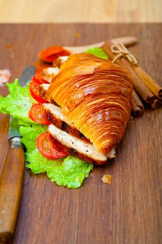 savory croissant brioche bread with chicken breast and vegetable rustic style 