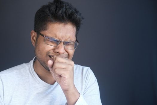 Portrait of sick man sneezes and coughs,