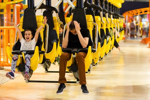 Father and Daughter On Amusement Park Roller Coaster