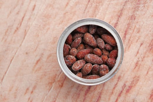 Close up of almond nuts in a bowl .