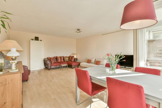 Huge living room with plush pale red sofa