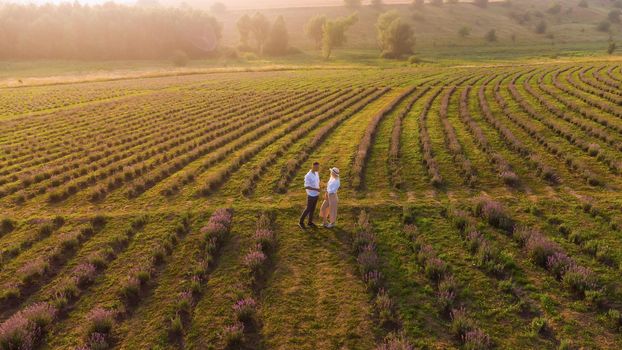 Young couple playing around in the lavender fields.