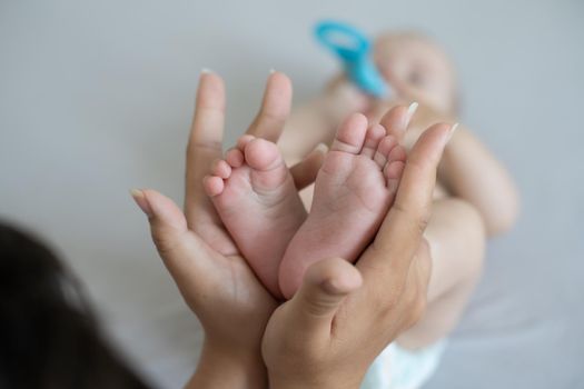 A close-up of tiny baby feet.
