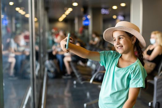 little girl with suitcase travel in the airport, kids travel.