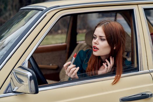 woman peeking out of car trip lifestyle fashion. High quality photo