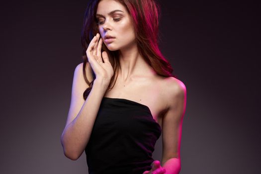 portrait of a woman black dress posing studio fashion hairstyle model lifestyle. High quality photo