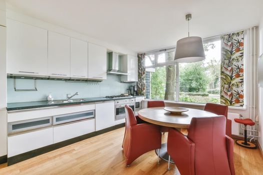 Beautiful kitchen combined with a dining room for four