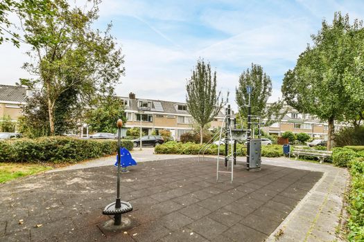 View of a beautiful playground with houses in the background