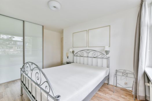 Cozy and elegant bedroom with full wall wardrobe