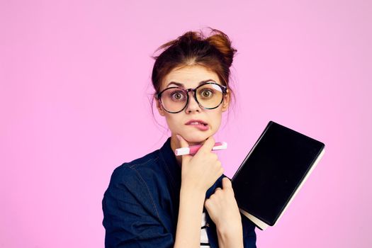 woman secretary with notepad and pencil office work pink background. High quality photo