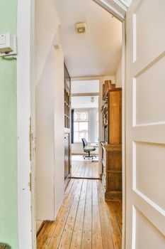 An elegant long corridor with a solid wooden floor