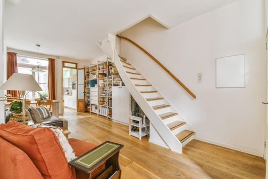 Lovely large room with an elegant staircase