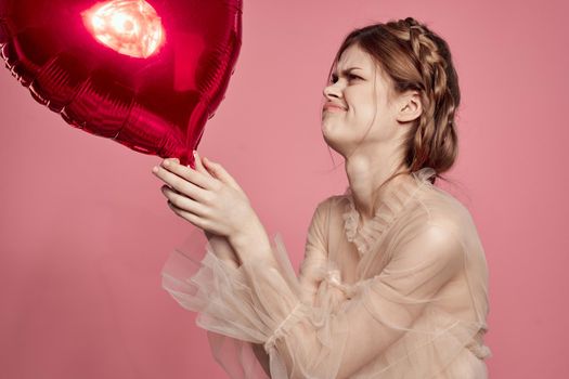 portrait of a woman in a dress balloon Valentine's Day isolated background. High quality photo