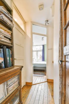 An elegant long corridor with a solid wooden floor