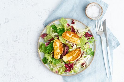 Cyprus fried halloumi with healthy salad. Lchf, pegan, fodmap, paleo, scd, keto, ketogenic diet. Balanced food, clean eating recipe. Top view, copy space, white background