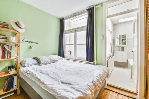 Small bedroom with a large comfortable soft bed