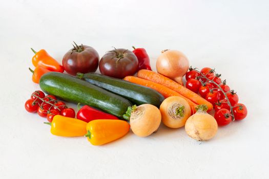 bright organic vegetables on the white background, concept of healthy food