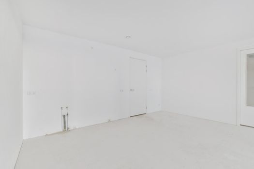 Modern room with wooden floor and white walls