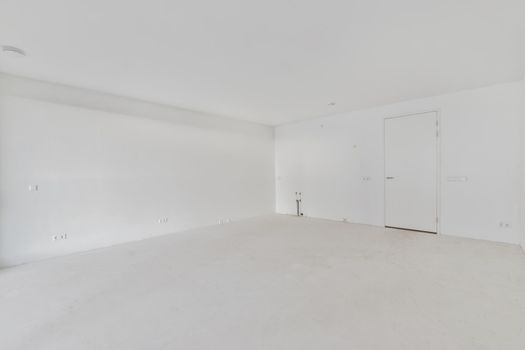 Modern room with wooden floor and white walls