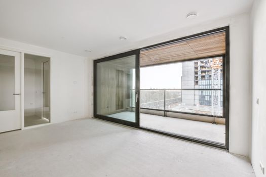 Modern room with wooden floor and white walls