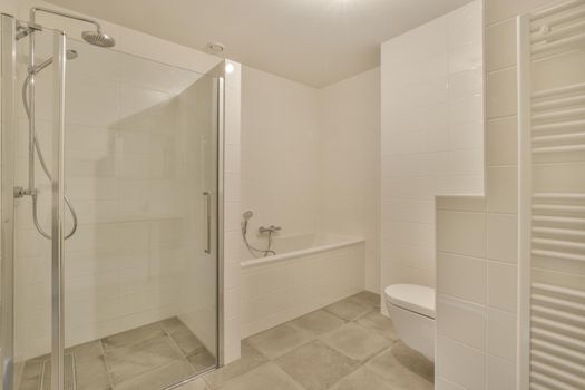 Interior of modern bathroom with shower cabin in the modern washroom