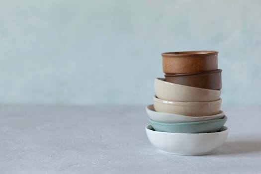 small bowls on the light green background, rustic style, selective focus