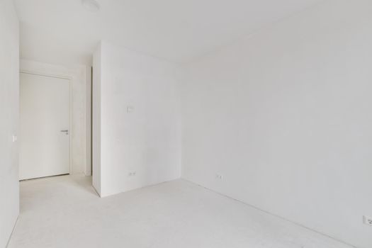 Modern room with wooden floor and white walls