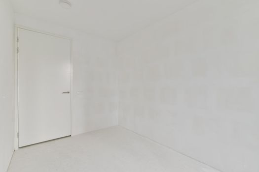 Modern room with wooden floor and white walls
