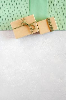 craft paper New Year and Christmas gift boxes and green paper gift bags, copy space