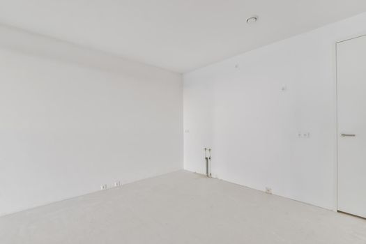 Modern room with wooden floor and white walls