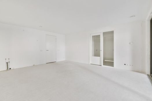 Modern room with wooden floor and white walls