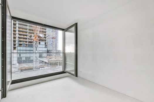 Modern room with wooden floor and white walls