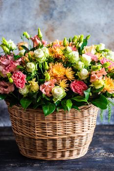 Floral autumnal composition with seasonal flowers for rustic interior or gift concept