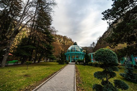 Famous mineral water spring fountain in city park of Borjomi in the mountains of Georgia