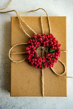 Holiday card concept with gift boxes and ribbon on concrete background