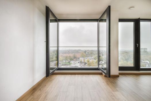 Modern room with wooden floor and white walls