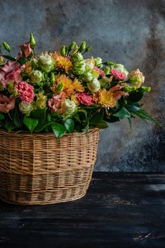 Floral autumnal composition with seasonal flowers for rustic interior or gift concept