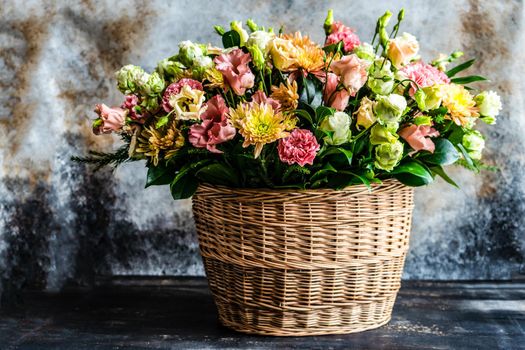 Floral autumnal composition with seasonal flowers for rustic interior or gift concept