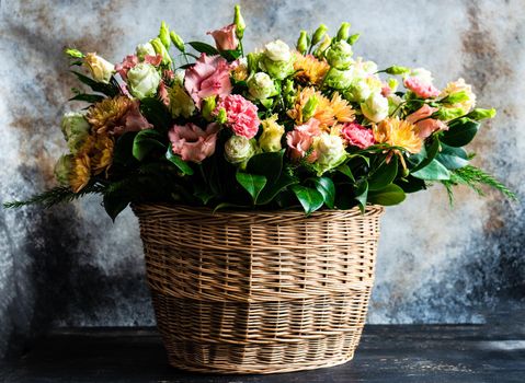 Floral autumnal composition with seasonal flowers for rustic interior or gift concept
